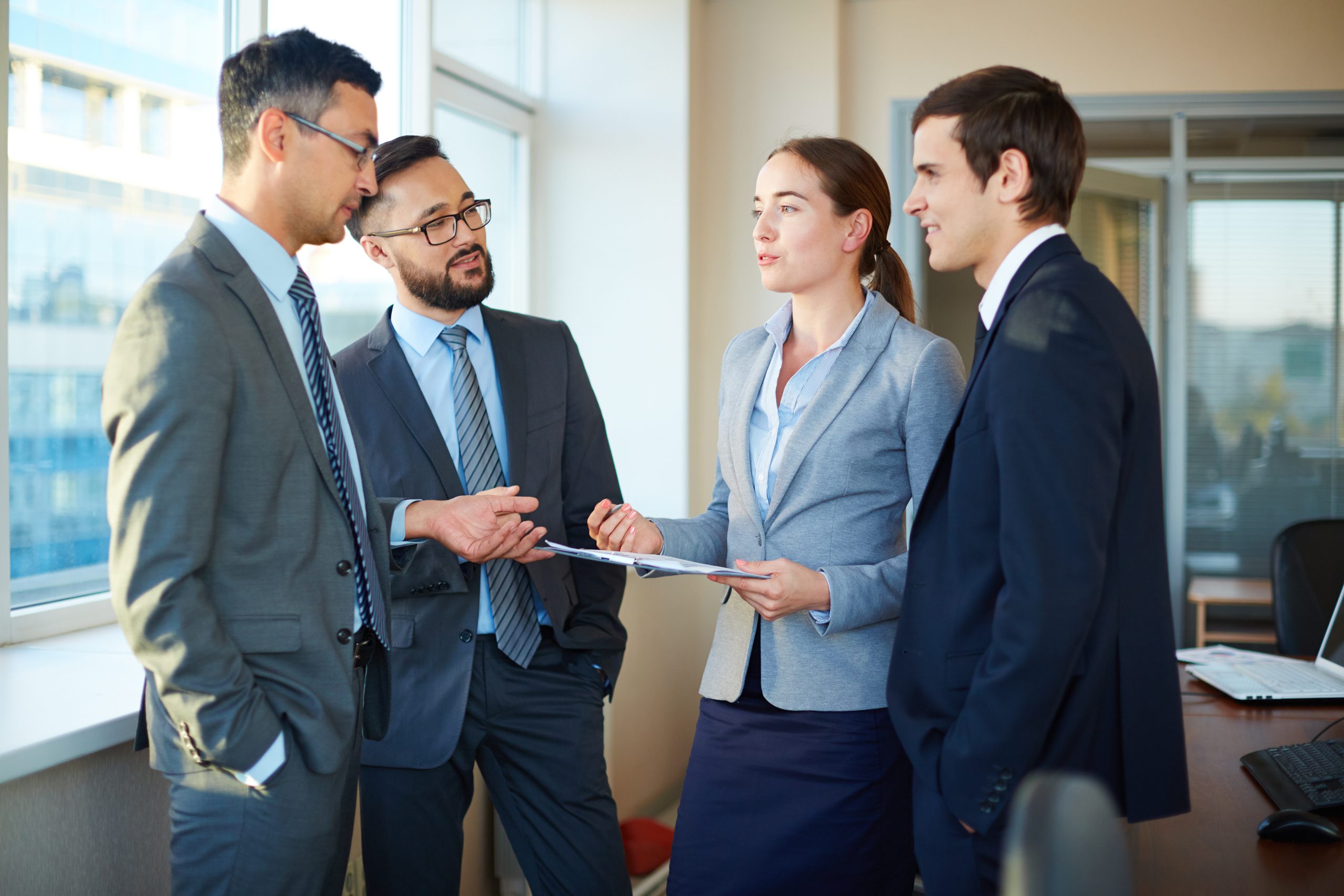 employees-reviewing-clipboard-scaled